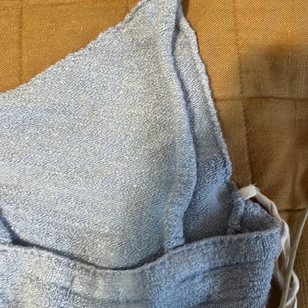 I’m selling a baby blue tank top that could rock with jeans.